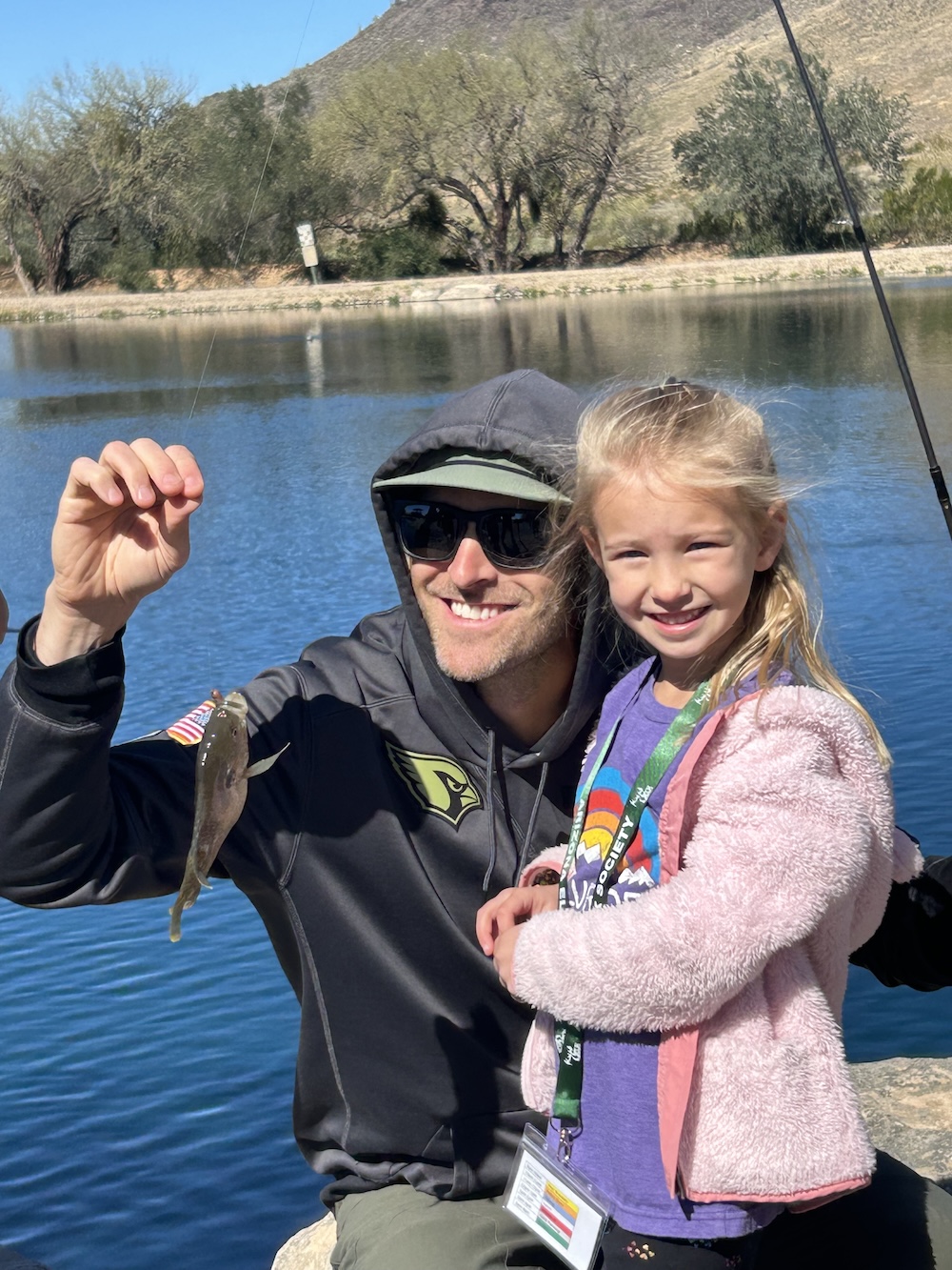 WIC 2.21.26 kid and dad fish pic